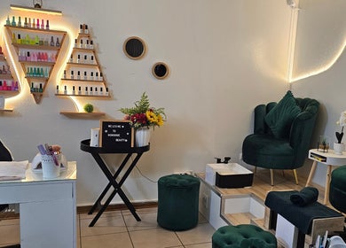 Elegant nail salon interior at Nominnie Beauty, Bloemfontein, Free State, ZA offering a tranquil atmosphere.