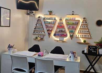 Nominnie Beauty nail station with colorful polish display in Bloemfontein, Free State, ZA.