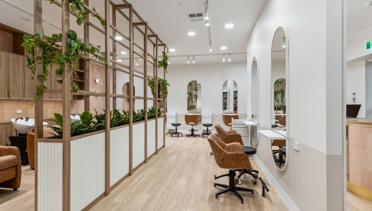 Elegant seating and decor at La Lueur Salon, Adelaide, South Australia, AU, showcasing a stylish ambience.
