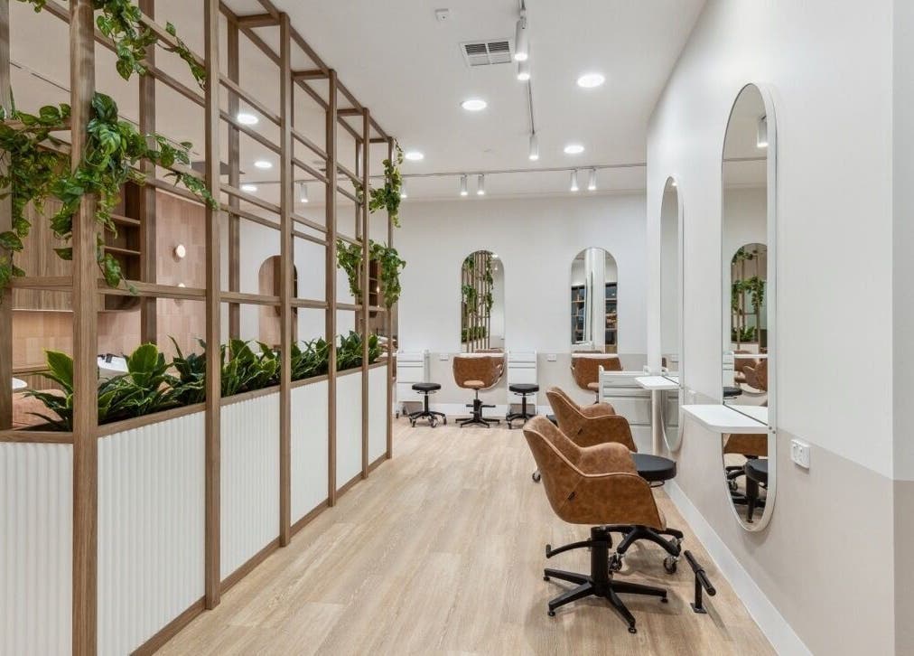 Elegant seating and decor at La Lueur Salon, Adelaide, South Australia, AU, showcasing a stylish ambience.