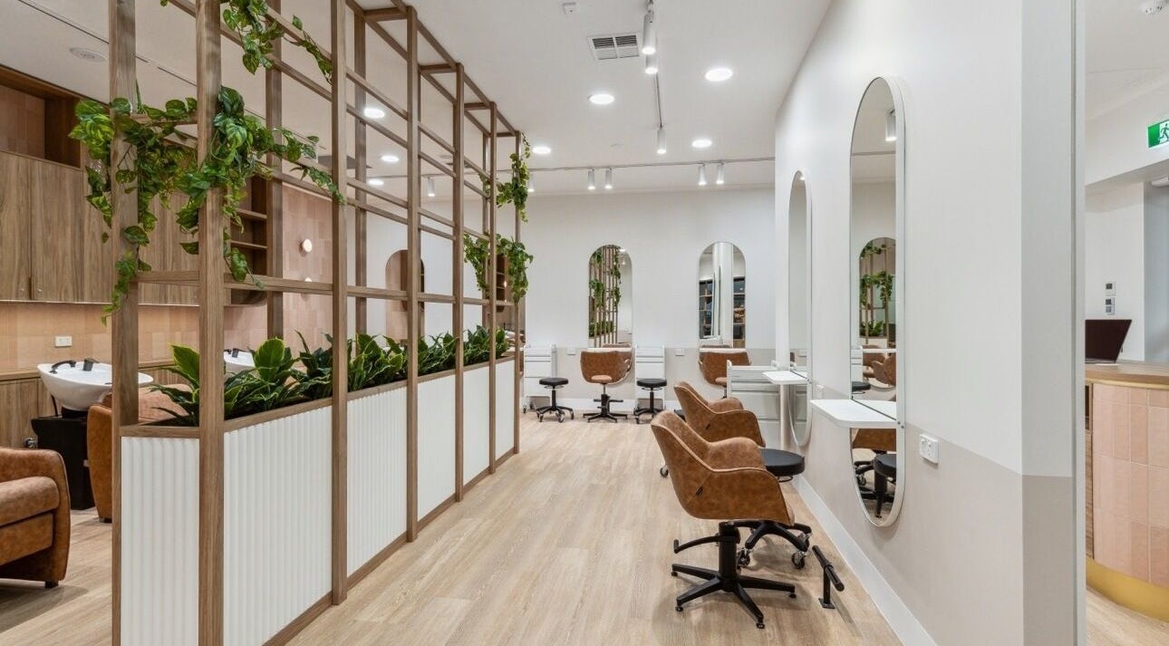 Elegant seating and decor at La Lueur Salon, Adelaide, South Australia, AU, showcasing a stylish ambience.