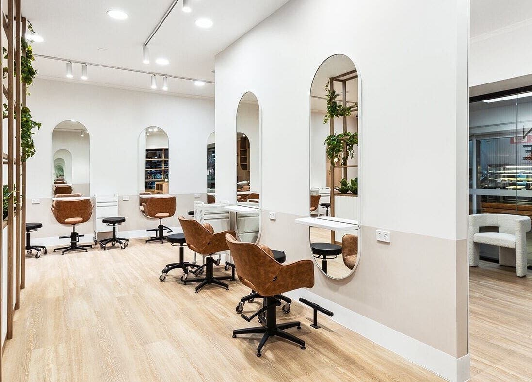 Interior of La Lueur Salon showcasing elegant styling stations in Adelaide, South Australia, AU.