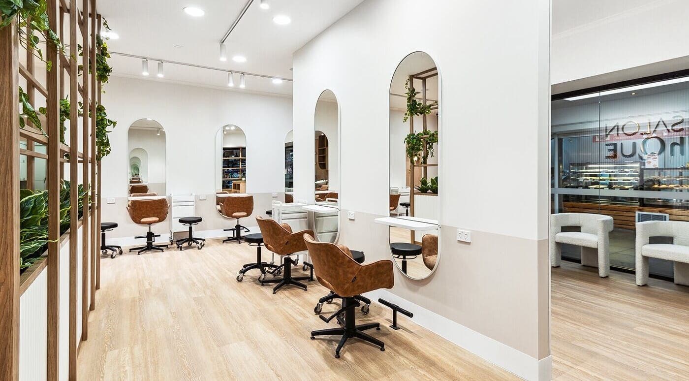 Interior of La Lueur Salon showcasing elegant styling stations in Adelaide, South Australia, AU.