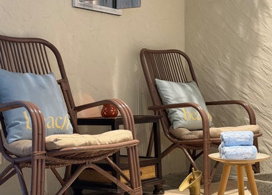 Cozy rattan chairs with plush pillows at Beach Spa Social, Kuala Lumpur, Wilayah Persekutuan Kuala Lumpur, MY.