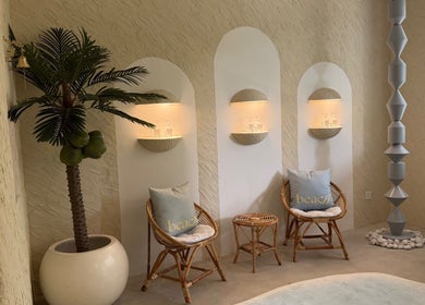 Cozy seating area with palm decor at Beach Spa Social, Kuala Lumpur, Wilayah Persekutuan Kuala Lumpur, MY.