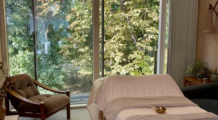 Relaxing spa room at SlowSkin Facials, London, England, GB with nature view.