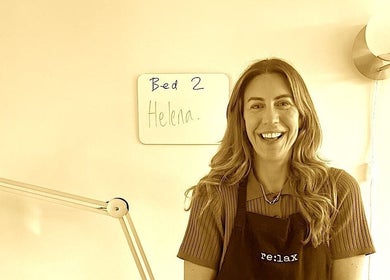 Warm atmosphere at SlowSkin Facials in London, England, GB, featuring a friendly staff member.
