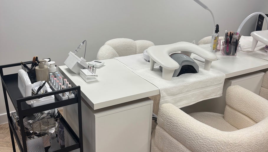 Modern nail station at Polished by Asha, Haywards Heath, England, GB with manicure tools and chairs.