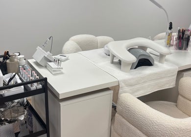 Modern nail station at Polished by Asha, Haywards Heath, England, GB with manicure tools and chairs.