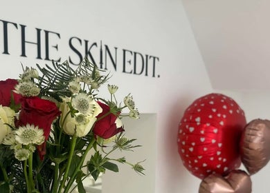 Red and white roses at Polished by Asha, Haywards Heath, England, GB. Elegant setting with balloons.