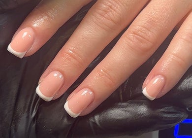French manicure at Polished by Asha, Haywards Heath, England, GB. Close-up of natural elegance.