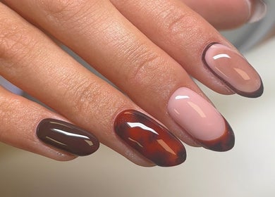 Sophisticated nail art at Polished by Asha, Haywards Heath, England, GB showcasing rich brown and nude hues.