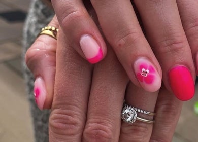 Pink floral nail art at No10 Beauty & Aesthetics in Woodbridge, England, GB. Perfectly polished nails.