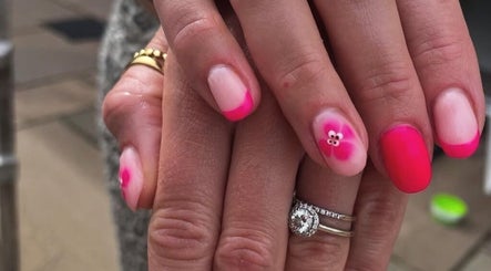 Pink floral nail art at No10 Beauty & Aesthetics in Woodbridge, England, GB. Perfectly polished nails.