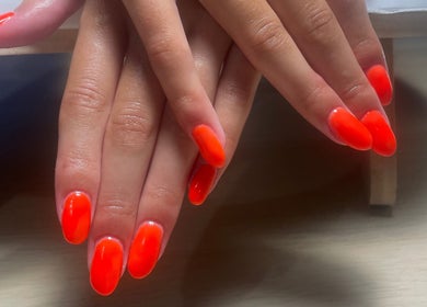 Bright orange nails design at No10 Beauty & Aesthetics, Woodbridge, England, GB.