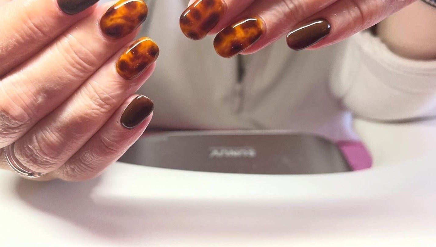 Stylish tortoiseshell nails at Polished by Molly in Hedge End, England, GB, showcasing skilled artistry.