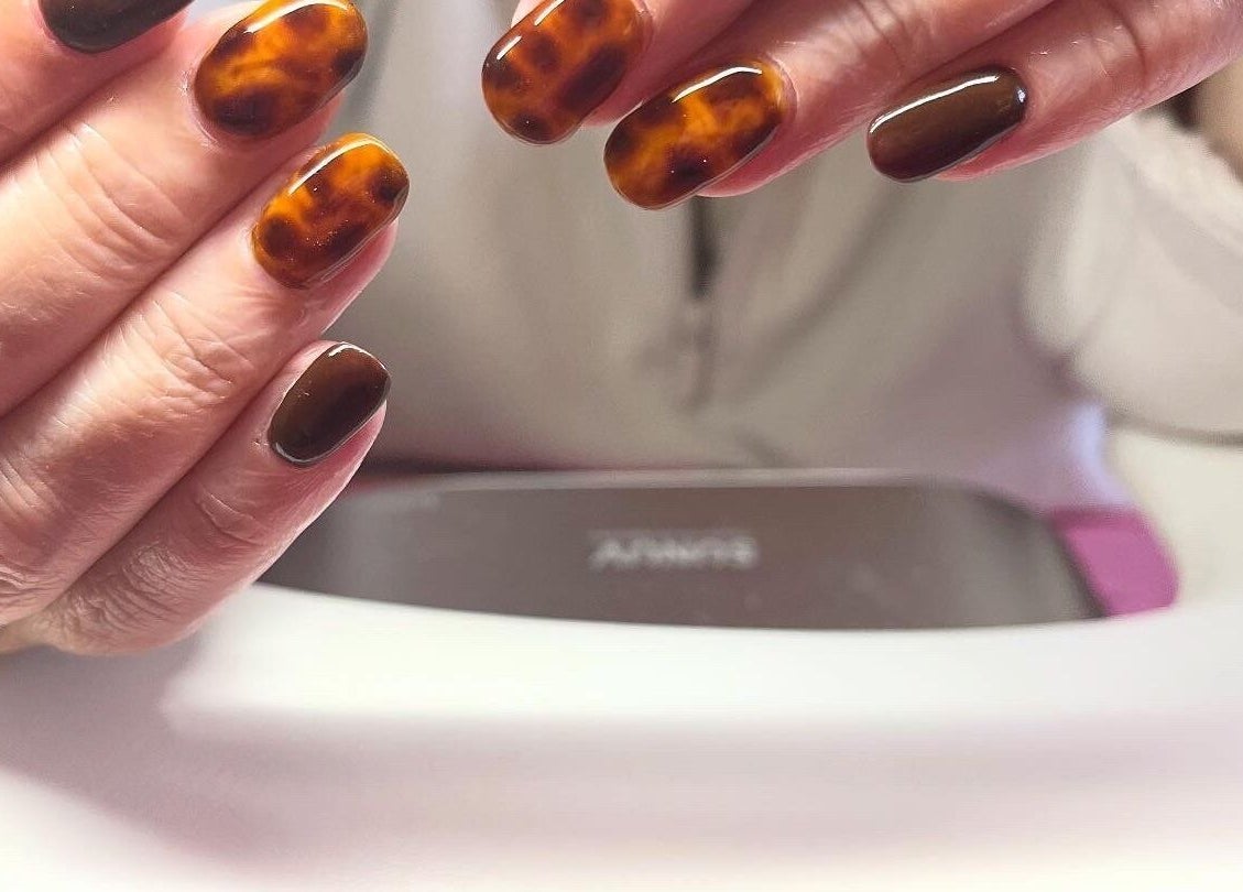 Stylish tortoiseshell nails at Polished by Molly in Hedge End, England, GB, showcasing skilled artistry.