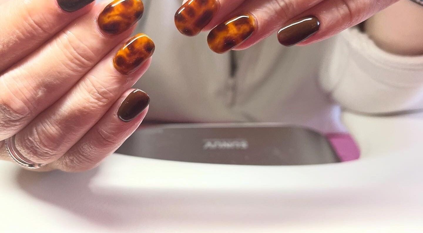 Stylish tortoiseshell nails at Polished by Molly in Hedge End, England, GB, showcasing skilled artistry.