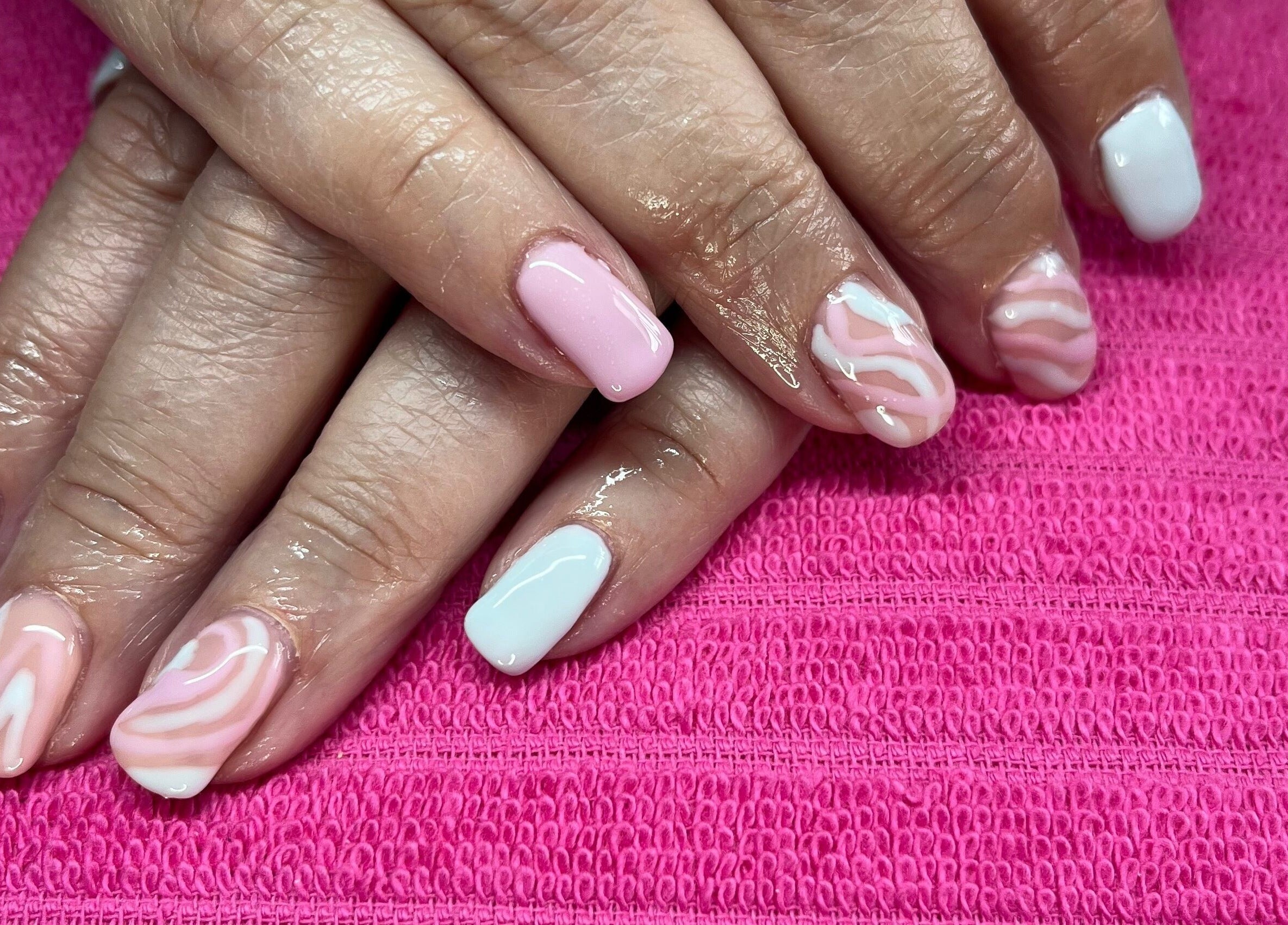 Beautiful pink and white nail art at Polished by Molly, Hedge End, England, GB, showcasing intricate designs.