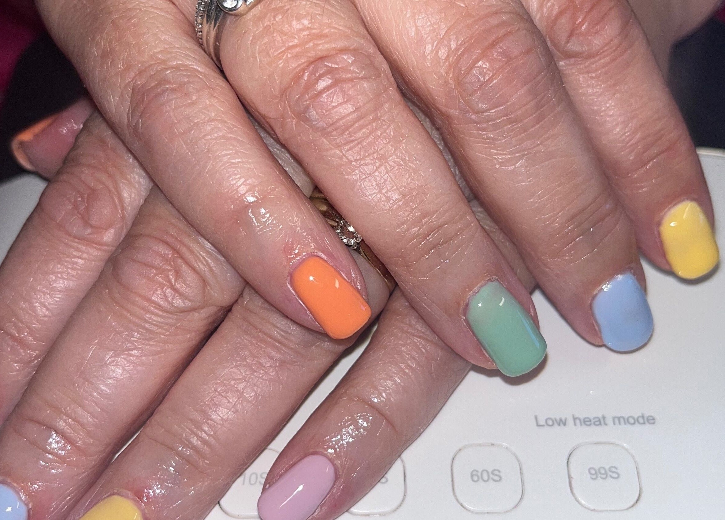 Vibrant pastel nails at Polished by Molly, Hedge End, England, GB showcasing colorful nail art.