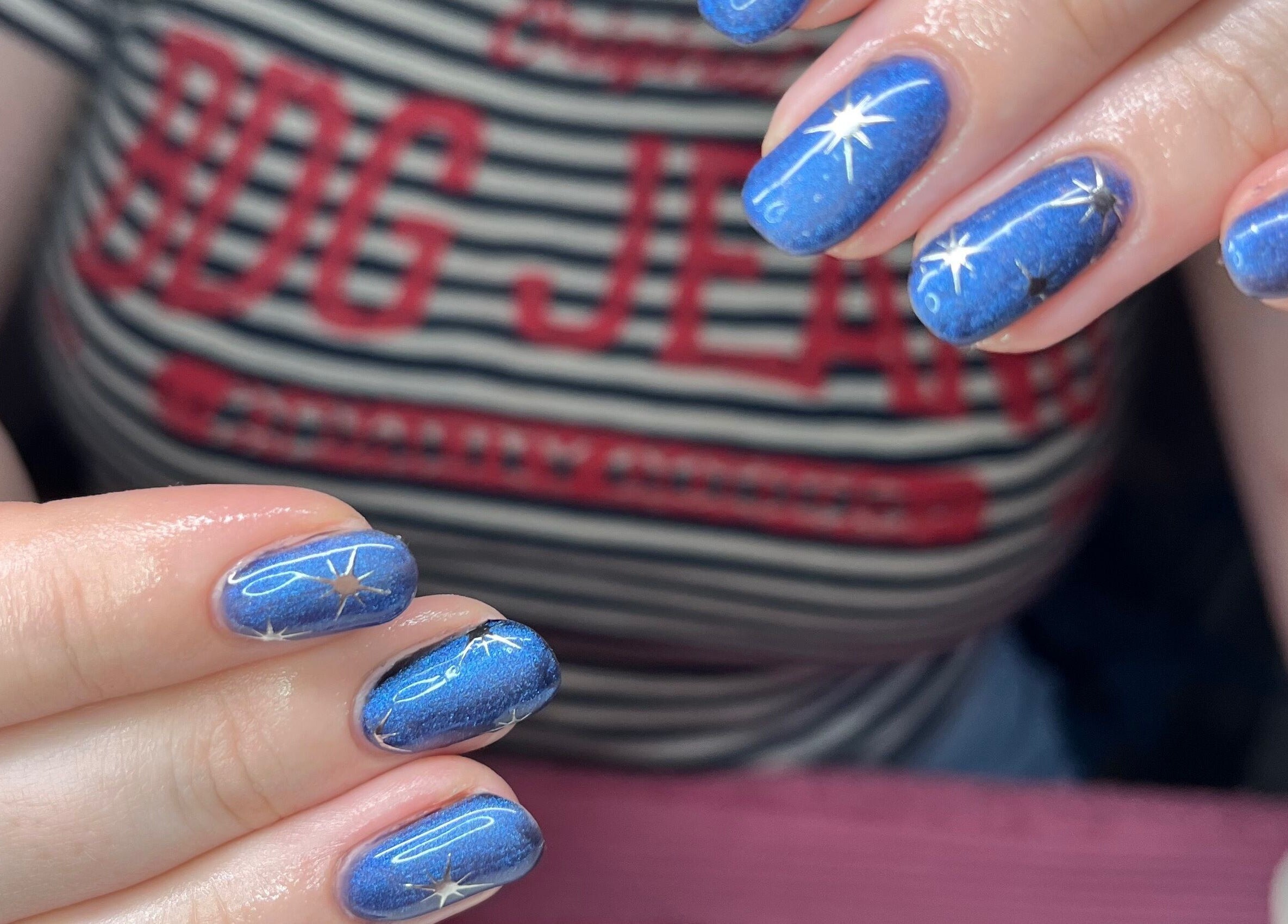 Starry blue nail art at Polished by Molly, Hedge End, England, GB. Perfect for a celestial manicure.