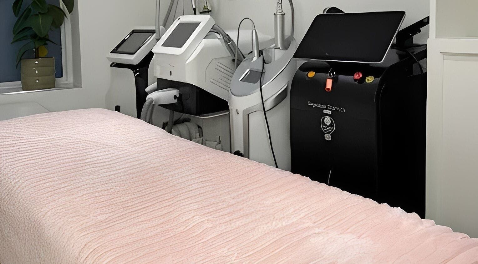 Modern treatment room at Dotyk Beauty Therapy, London, England, GB, featuring advanced spa equipment.