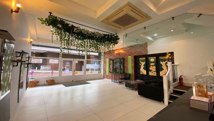 Elegant interior of Regency Massage & Spa in Blackburn, England, GB, featuring lush greenery and calming decor.