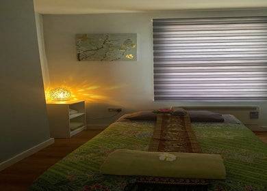Relaxing massage room at Regency Massage & Spa in Blackburn, England, GB with soft lighting and cozy decor.
