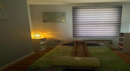 Relaxing massage room at Regency Massage & Spa in Blackburn, England, GB with soft lighting and cozy decor.