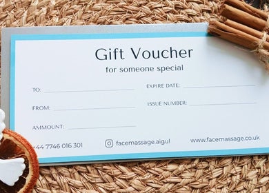 Gift voucher for Sculptore Face Massage Aigul, Northampton, England, GB on a woven mat with decoration.
