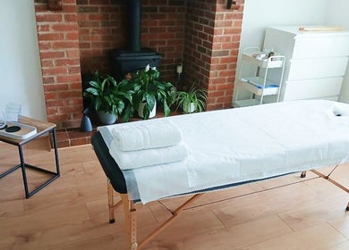 Tranquil massage room at Facial Massage Aigul, Northampton, England, GB with massage table and calming decor.