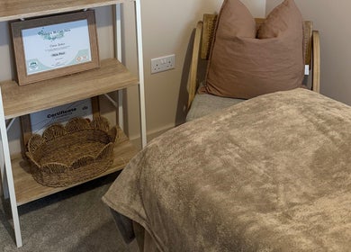 Comfortable treatment bed at Chloe Zeller Skin, Tockwith, England, GB with certificate display.