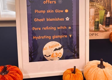 Serene Glow by Charlotte Aimée Halloween facial offers in Bristol, England, GB with pumpkins and skincare products.