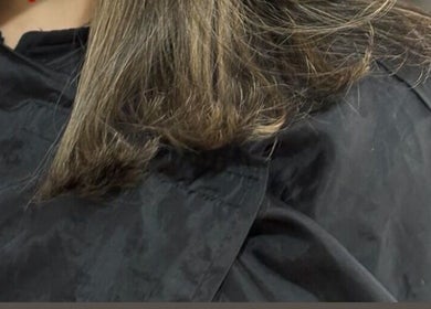 Close-up of freshly trimmed hair at Hair By Amina, London, England, GB in a stylish salon setting.