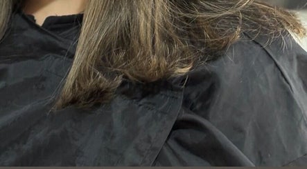 Close-up of freshly trimmed hair at Hair By Amina, London, England, GB in a stylish salon setting.