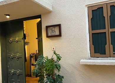 Inviting entrance of Glowin Salon in Abha, Al Athar 7507, SA featuring greenery and a warm ambiance.