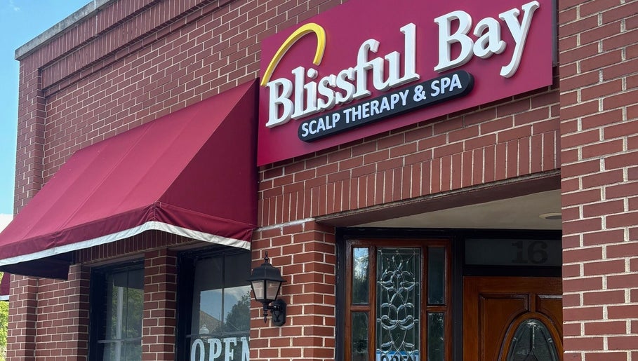 Front view of Blissful Bay Inc., located in Schaumburg, Illinois, US, with a welcoming red canopy.