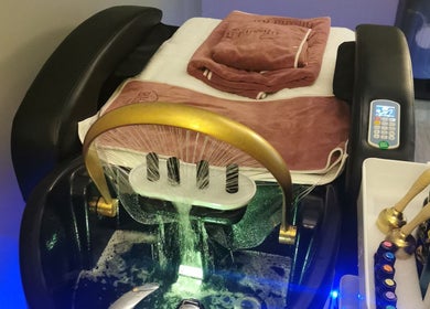 Relaxing spa chair setup at Blissful Bay Inc. in Schaumburg, Illinois, US, with towels and wellness products.