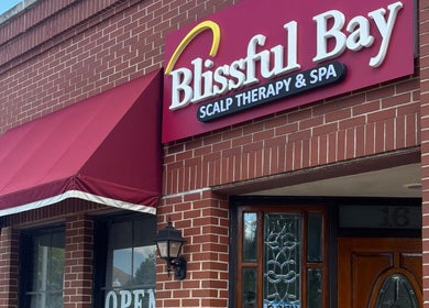 Front view of Blissful Bay Inc. with red canopy in Schaumburg, Illinois, US.