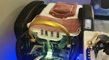 Deluxe massage chair at Blissful Bay Inc., Schaumburg, Illinois, US with towels and wellness products.