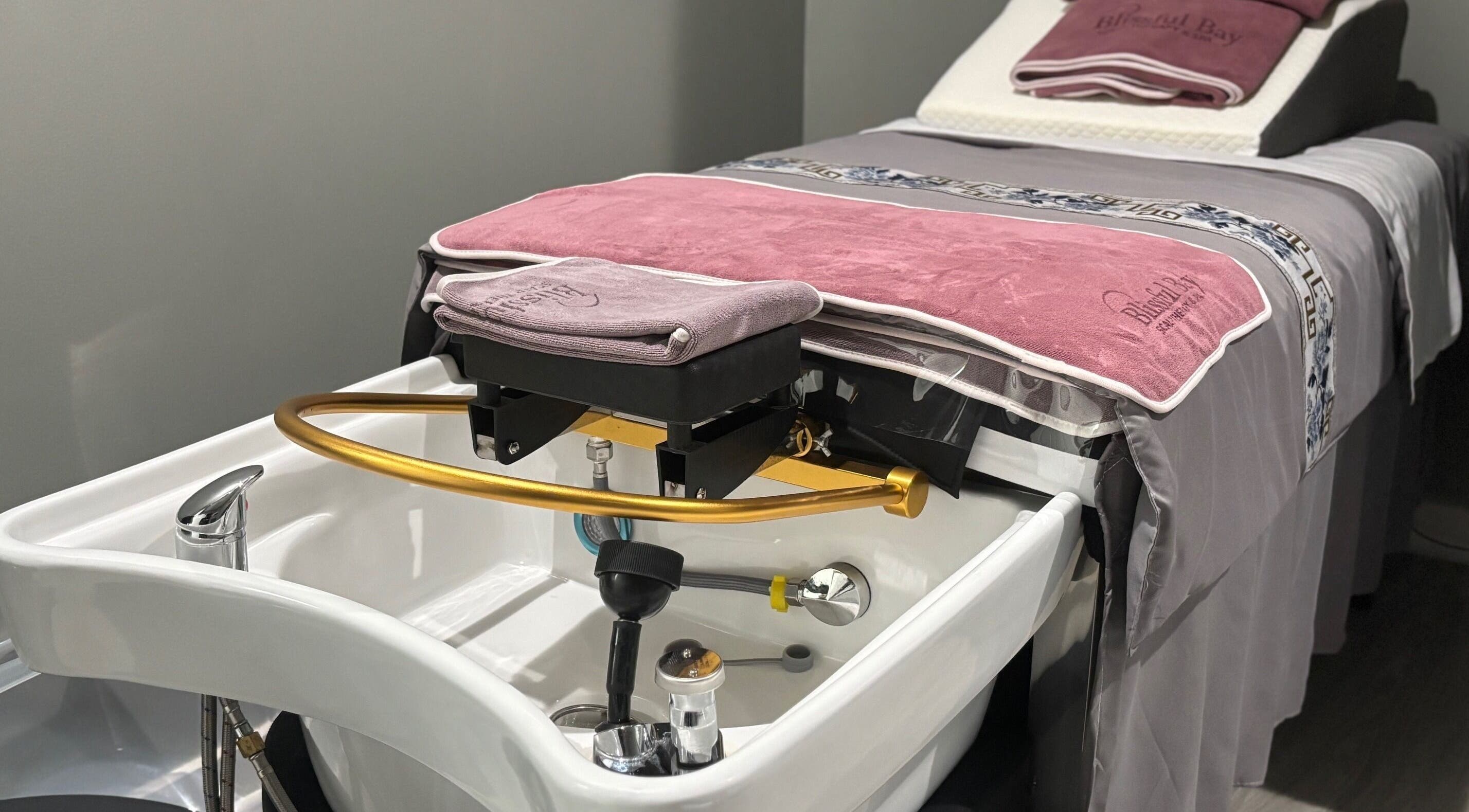 Luxury treatment bed at Blissful Bay Inc., Schaumburg, Illinois, US with elegant spa features.