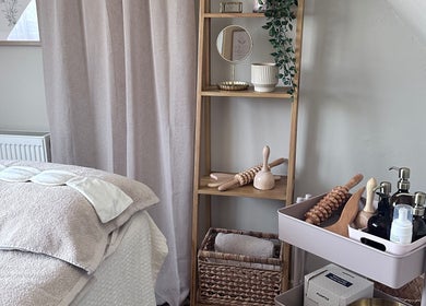 Tranquil therapy room at Lola & Bloom, Stanstead Abbotts, England, GB, showcasing massage tools and calming decor.
