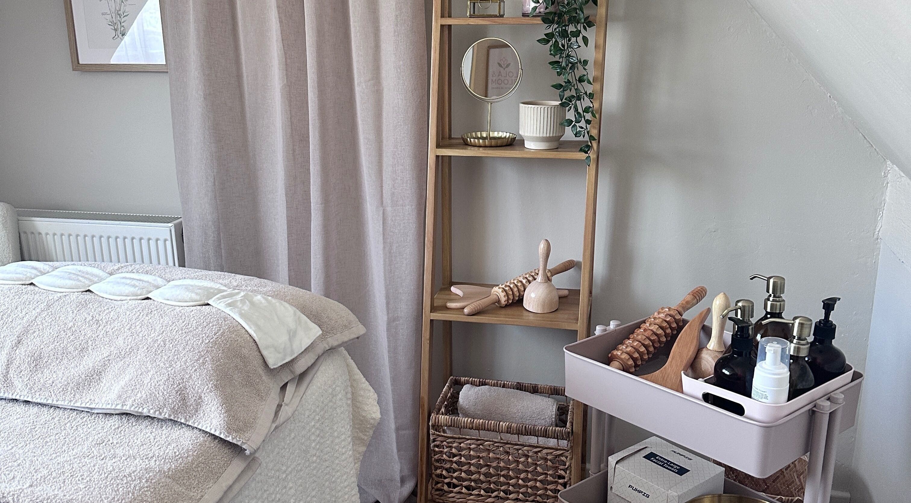 Cozy treatment room at Lola & Bloom in Stanstead Abbotts, England, GB, featuring calming decor and wellness tools.