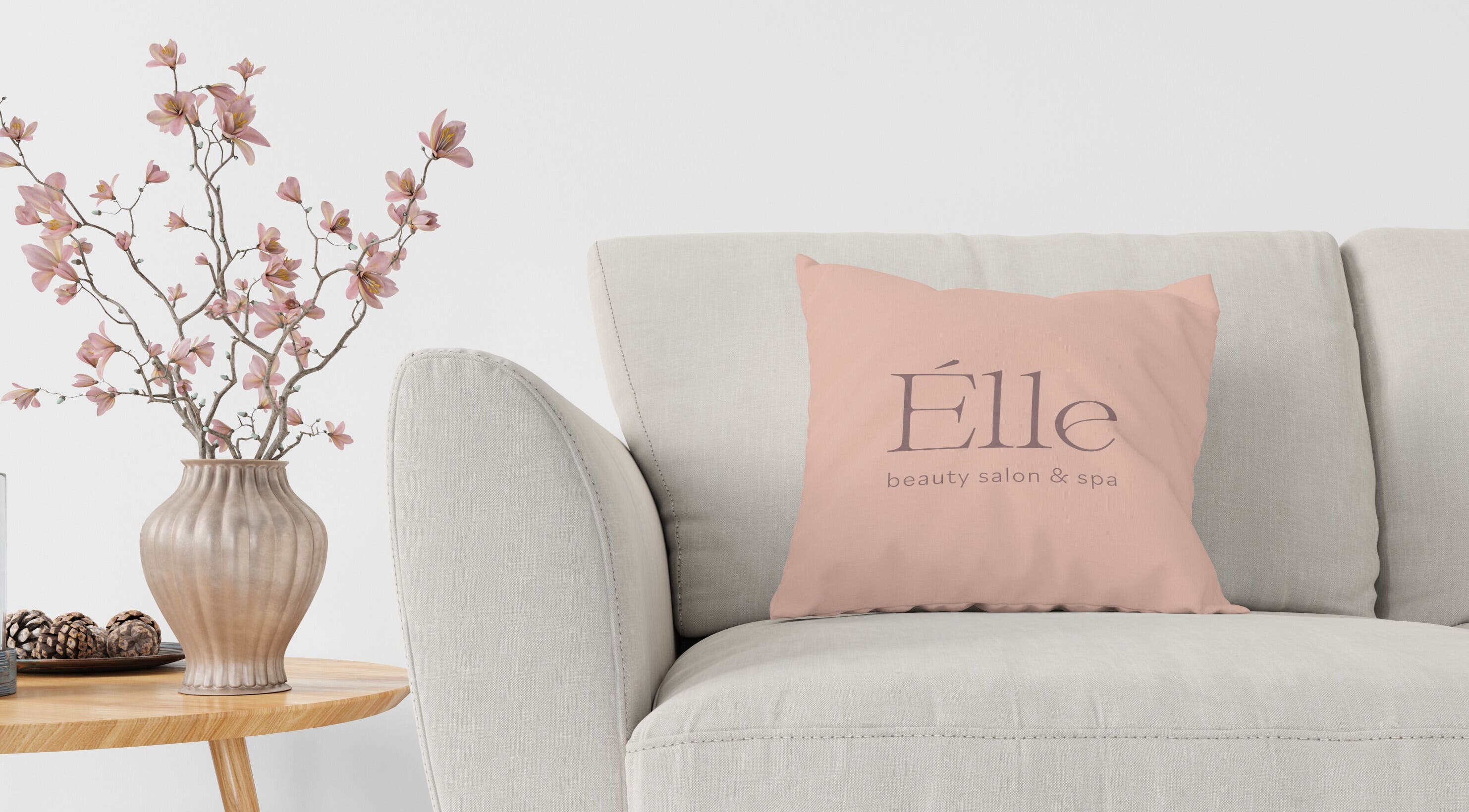Elegant lounge at Elle Beauty Salon & Spa in Sharjah with stylish decor and cozy pillow.