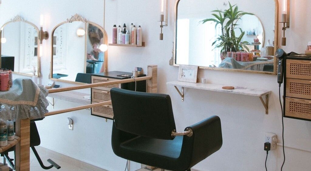 Elegant salon interior at Ki to Beauty Salon, Scottsdale, Arizona, US with chic mirror and styling chair.