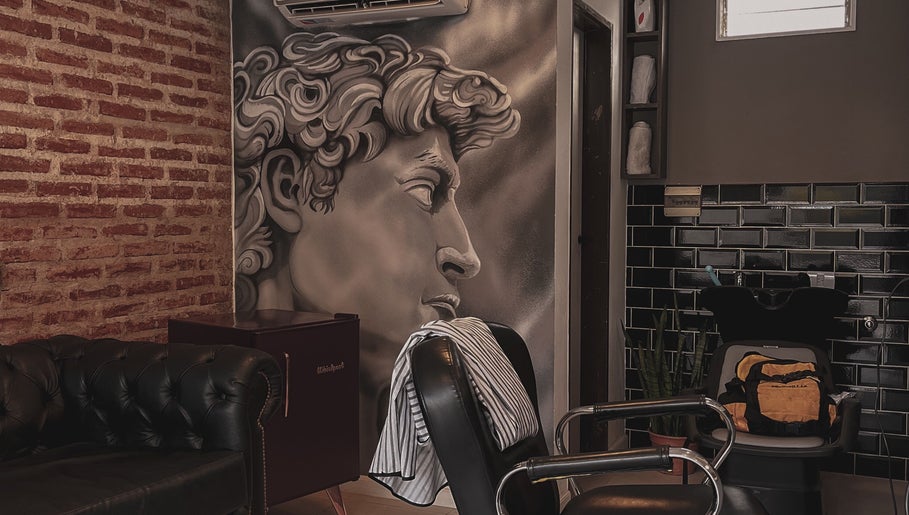 Stylish salon interior at Raustin, Córdoba, Córdoba, AR with artistic wall mural and modern decor.