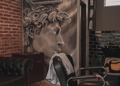 Stylish salon interior at Raustin, Córdoba, Córdoba, AR with artistic wall mural and modern decor.