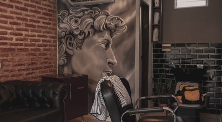 Stylish salon interior at Raustin, Córdoba, Córdoba, AR with artistic wall mural and modern decor.