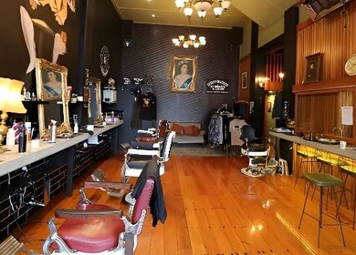 Elegant interior of Jetcharm Barbershop & Gentlemen’s Quarters, New Plymouth, Taranaki Region, NZ, with vintage decor.