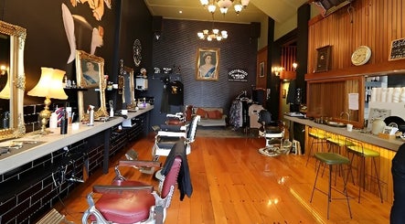 Elegant interior of Jetcharm Barbershop & Gentlemen’s Quarters, New Plymouth, Taranaki Region, NZ, with vintage decor.